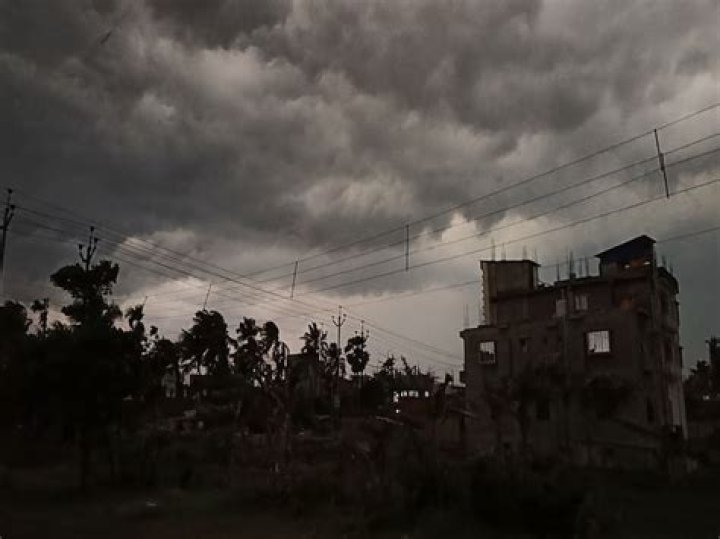 Why rain clouds are dark in Colour?